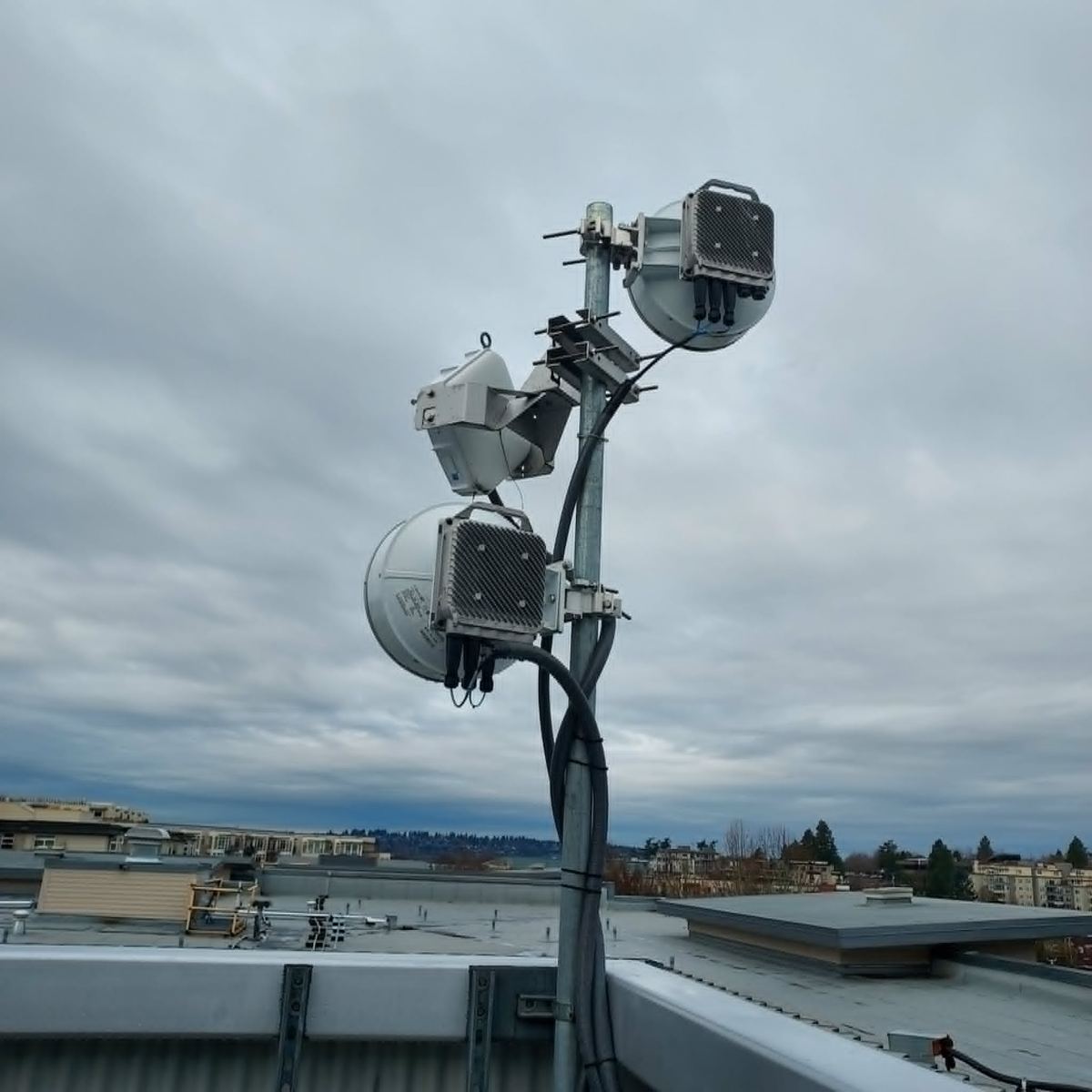 Zephyrline point-to-point radios mounted on a rooftop mast in Everett